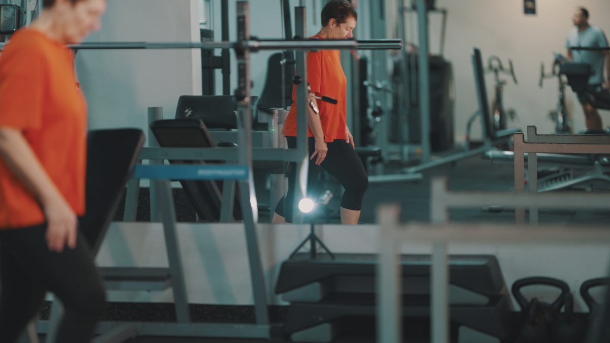 Older adult exercising in a gym for Medicare Advantage fitness benefit cost review 2027